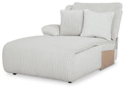 Ashley Furniture Top Tier reclining sectional with chaise, showcasing plush upholstery and reclining seats from a side angle.