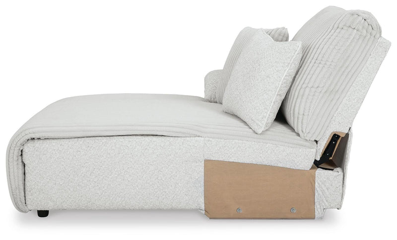 Ashley Furniture Top Tier reclining sectional with chaise, featuring plush cushions and a modern design in a neutral fabric.