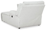 Ashley Furniture Top Tier reclining sectional sofa with chaise, showing plush cushions and reclining feature in a modern living room setting.