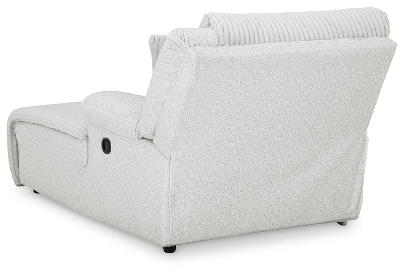 Ashley Furniture Top Tier reclining sectional sofa with chaise, showing plush cushions and reclining feature in a modern living room setting.