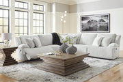 Ashley Furniture Top Tier reclining sectional sofa with plush cushions and reclining seats, shown in a modern living room setting.
