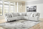 Ashley Furniture Top Tier reclining sectional sofa with plush cushions and modern design, shown in a living room setting.