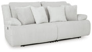 Ashley Furniture Top Tier sectional loveseat with plush cushions, shown from an angled view, closed style, in a cozy living room setting.