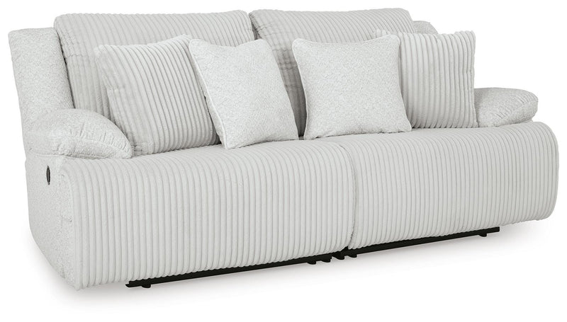Ashley Furniture Top Tier sectional loveseat with plush cushions, shown from an angled view, closed style, in a cozy living room setting.