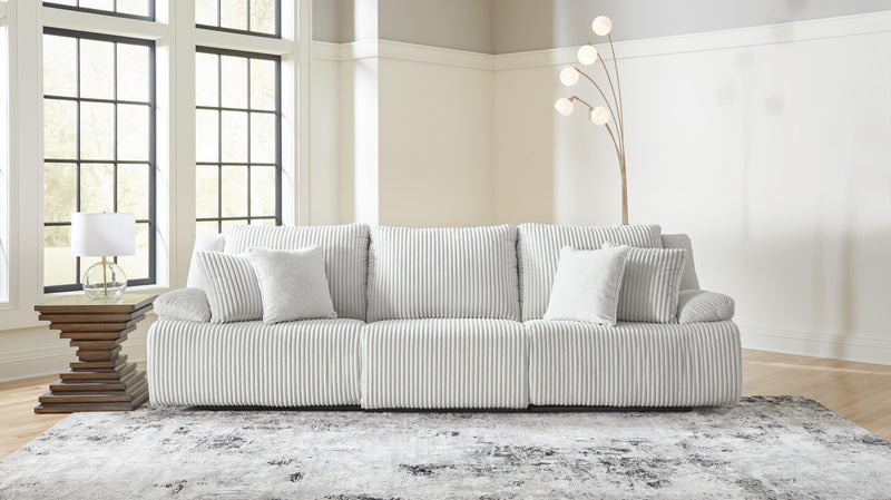 Ashley Furniture Top Tier sectional sofa with plush cushions and modern design, shown in a cozy living room setting.