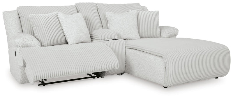 Ashley Furniture Top Tier reclining sectional sofa with chaise, featuring plush cushions and a modern design, shown from an open angle.