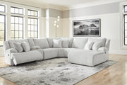 Ashley Furniture Top Tier reclining sectional with chaise, featuring plush cushions and modern design in a cozy living room setting.