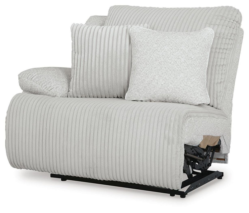 Ashley Furniture Top Tier reclining sectional sofa with chaise, featuring plush cushions and a modern design, viewed from an angle.