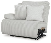 Ashley Furniture Top Tier Sectional Chofa showing a modern sectional sofa with plush cushions and a sleek design from an angled view.