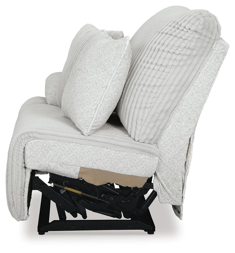 Ashley Furniture Top Tier reclining sectional sofa with chaise, featuring plush seats and modern design in a living room setting.