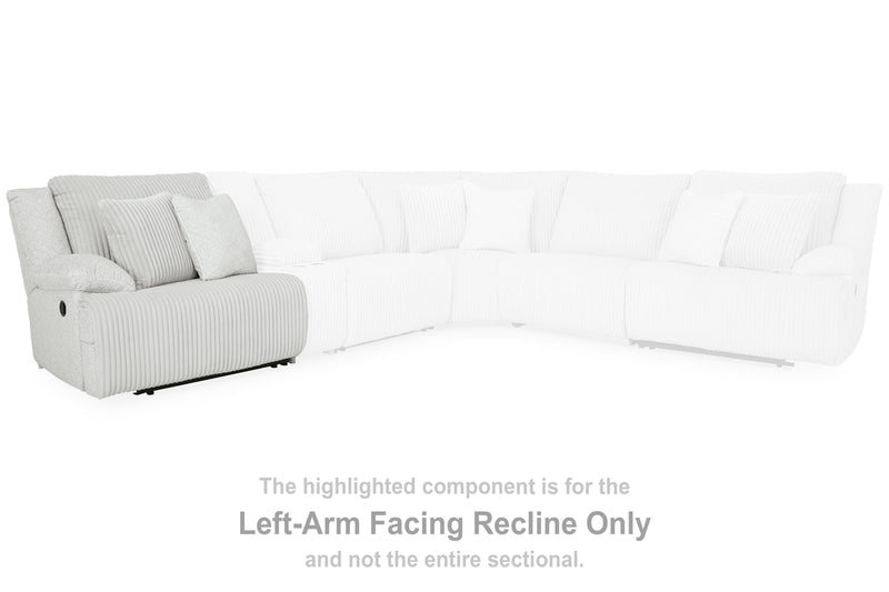 Ashley Furniture Top Tier reclining sectional sofa with chaise, featuring plush cushions and modern design in a warm neutral fabric.