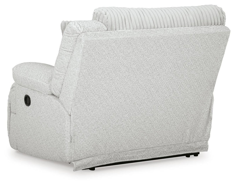 Ashley Furniture Top Tier reclining sectional with chaise, showing plush fabric and reclining seats in a modern living room setting.