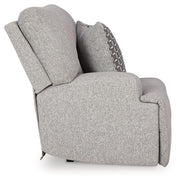 Ashley Furniture Acklen Place sectional sofa with beige upholstery and plush cushions, shown with a side view in a modern living room setting.