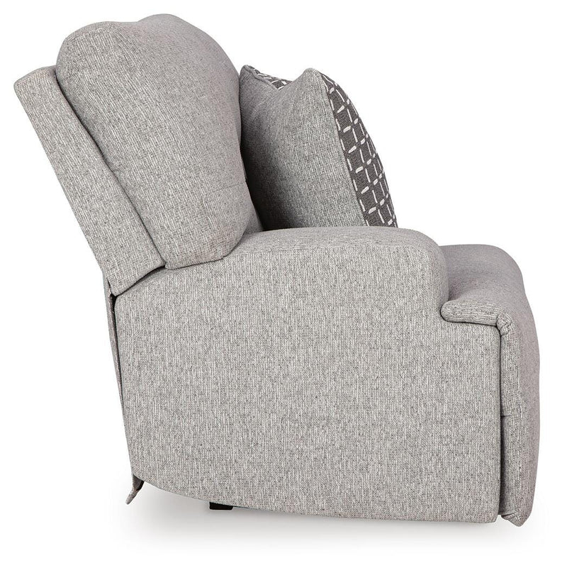Ashley Furniture Acklen Place sectional sofa with beige upholstery and plush cushions, shown with a side view in a modern living room setting.