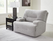 Ashley Furniture Acklen Place oversized power recliner in closed position, plush fabric with padded armrests and modern design.