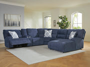 Ashley Furniture Acklen Place power reclining sectional with chaise, featuring plush cushions and modern design, shown from a front angle.