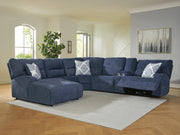 Ashley Furniture Acklen Place power reclining sectional with chaise, shown in a cozy living room setting.
