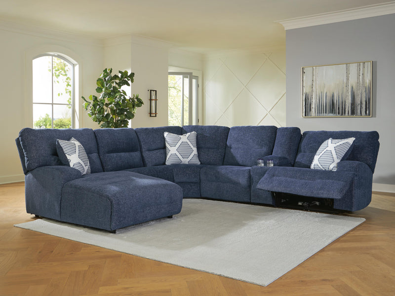 Ashley Furniture Acklen Place power reclining sectional with chaise, shown in a cozy living room setting.