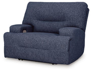 Ashley Furniture Acklen Place oversized power recliner viewed from an angle, featuring plush upholstery and a closed recline position.