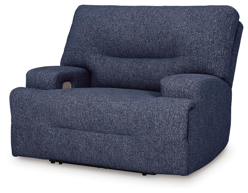 Ashley Furniture Acklen Place oversized power recliner viewed from an angle, featuring plush upholstery and a closed recline position.