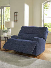 Open Ashley Furniture Acklen Place oversized power recliner showing plush upholstery and reclining mechanism in a modern living room setting.