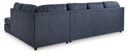 Ashley Furniture Albar Place sectional sofa with plush cushions and neutral fabric, shown from the back view in the image.