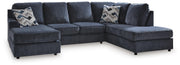 Ashley Furniture Albar Place sectional sofa with plush cushions and neutral fabric, showcasing a modern living room setup.