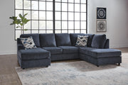 Ashley Furniture Albar Place sectional sofa with plush cushions and modern design, shown in a spacious living room setting.