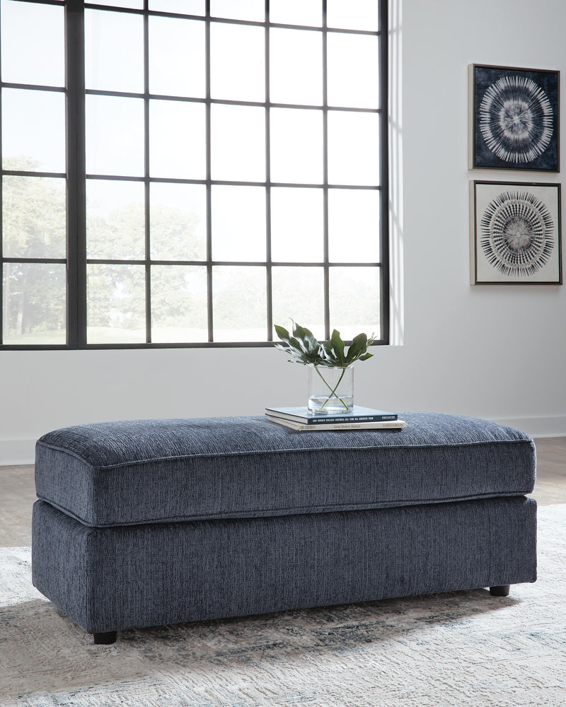 Ashley Furniture Albar Place oversized accent ottoman with plush fabric and modern design, shown in a living room setting.