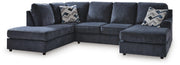 Ashley Furniture Albar Place sectional sofa with plush cushions and neutral fabric upholstery in a modern living room setting.