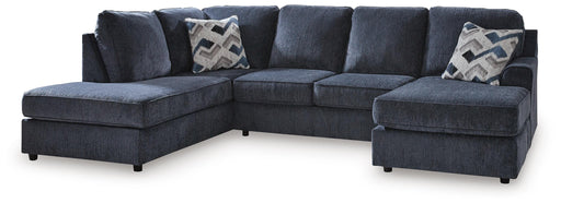 Ashley Furniture Albar Place sectional sofa with plush cushions and neutral fabric upholstery in a modern living room setting.