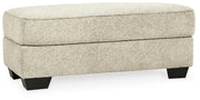 Ashley Furniture Monaghan oversized living room chair and ottoman set with plush fabric and contemporary design, shown from an angled view.