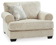 Ashley Furniture Monaghan living room set featuring a sofa and armchair in a modern design, shown from an angled side view.