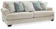 Ashley Furniture Monaghan Living Room Set featuring a sofa and armchair with neutral upholstery and modern design.