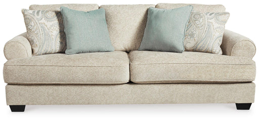 Ashley Furniture Monaghan sofa with plush cushions and neutral fabric, shown in a head-on view highlighting its inviting design.