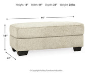Ashley Furniture Monaghan living room set with plush sofa and matching armchair in a modern, cozy living room setting.