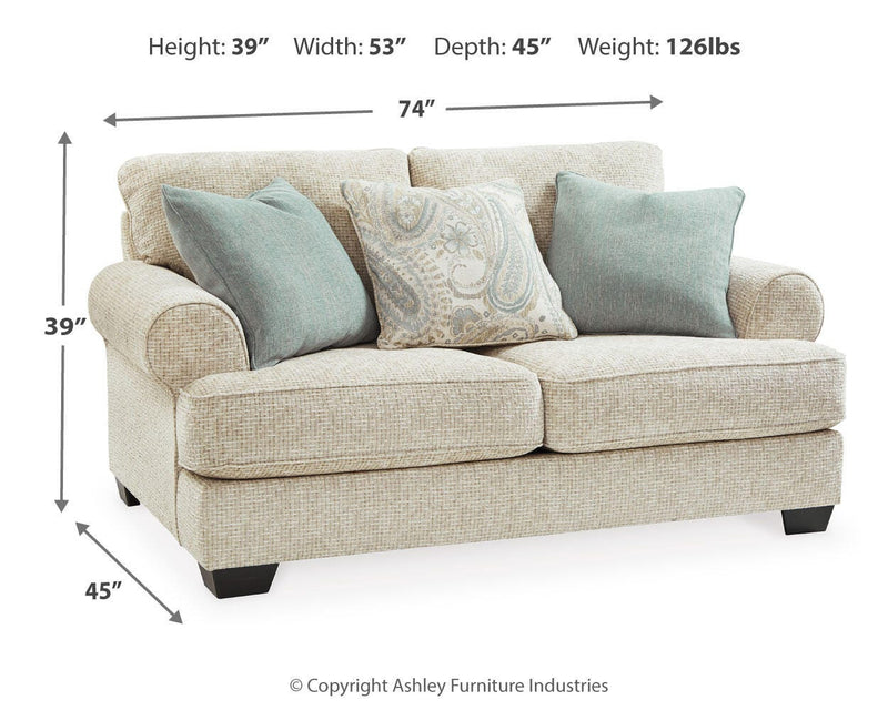 Ashley Furniture Monaghan living room set featuring a sofa and armchair with neutral fabric and modern design.