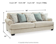 Ashley Furniture Monaghan living room set featuring a sofa and loveseat in a modern design with neutral fabric upholstery.