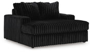 Ashley Furniture Midnight-Madness oversized chaise chair with plush upholstery, shown from an angled side view.