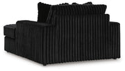 Ashley Furniture Midnight-Madness oversized chaise chair with plush upholstery and a modern design, shown from the back.
