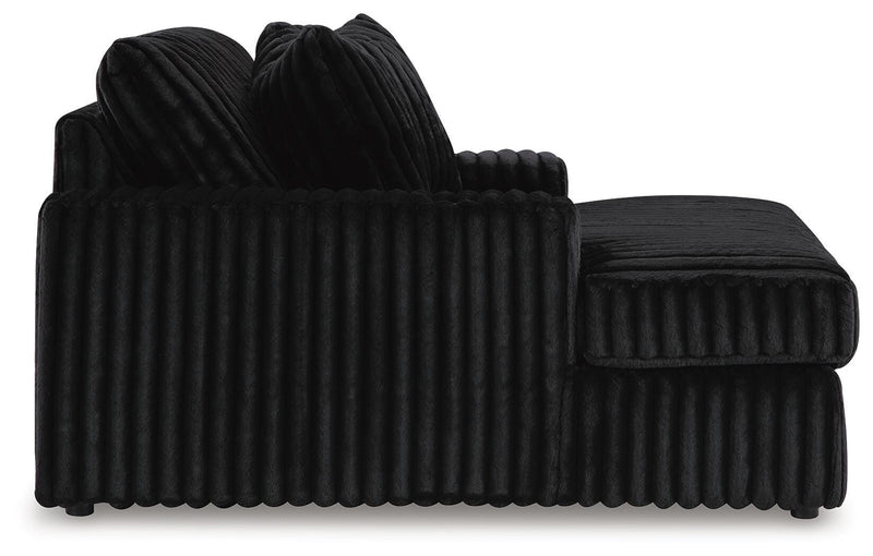 Ashley Furniture Midnight-Madness oversized chaise lounge chair with plush upholstery and modern design, shown from the side.