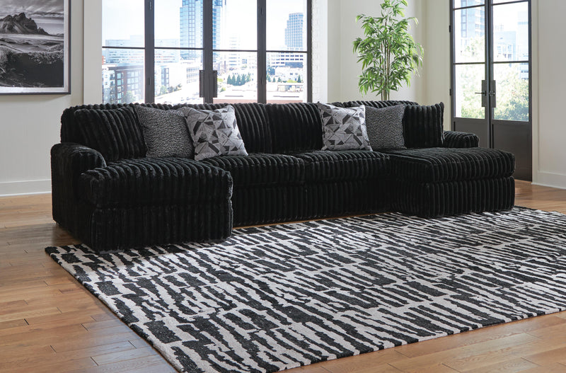 Ashley Furniture Midnight-Madness sectional with chaise, dark fabric sofa with plush cushions and modern design.