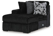 Ashley Furniture Midnight-Madness sectional with chaise, showcasing dark fabric upholstery and modern sectional design from an angled view.
