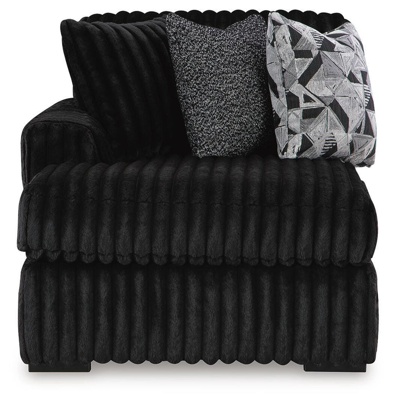 Ashley Furniture Midnight-Madness sectional with chaise, showing plush fabric and modern design from a head-on view.