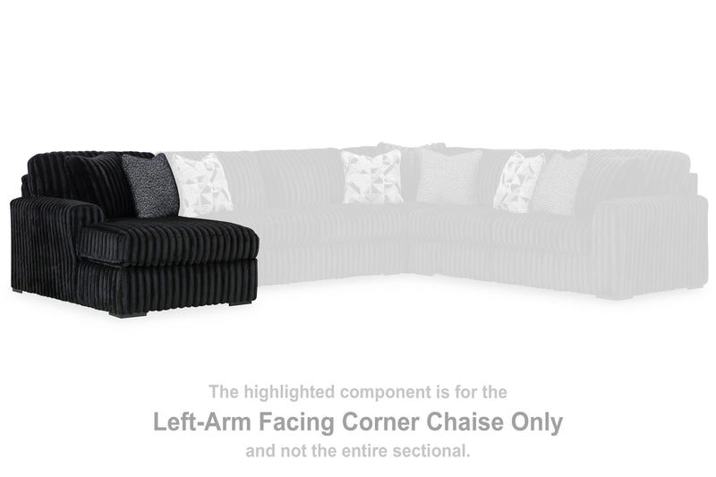 Ashley Furniture Midnight-Madness sectional with chaise, featuring dark upholstery and modern design, shown from a front angle.