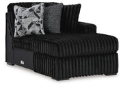 Ashley Furniture Midnight-Madness sectional with chaise, showing a modern dark fabric sectional sofa with a chaise lounge.