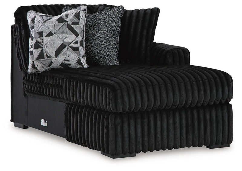 Ashley Furniture Midnight-Madness sectional with chaise, showing a modern dark fabric sectional sofa with a chaise lounge.