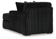 Ashley Furniture Midnight-Madness sectional with chaise, showcasing plush fabric, modern design, and comfortable seating arrangement.