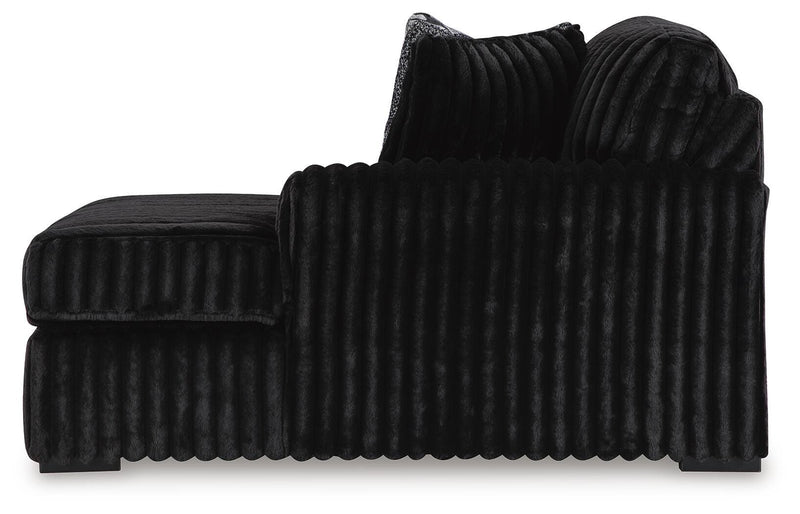 Ashley Furniture Midnight-Madness sectional with chaise, showing dark fabric upholstery and modern design with plush cushions.