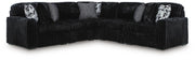 Ashley Furniture Midnight-Madness sectional sofa with plush cushions and dark fabric, shown in a stylish living room setting.